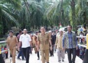 H Edimin Resmikan Rambin Desa Rasau Kecamatan Torgamba